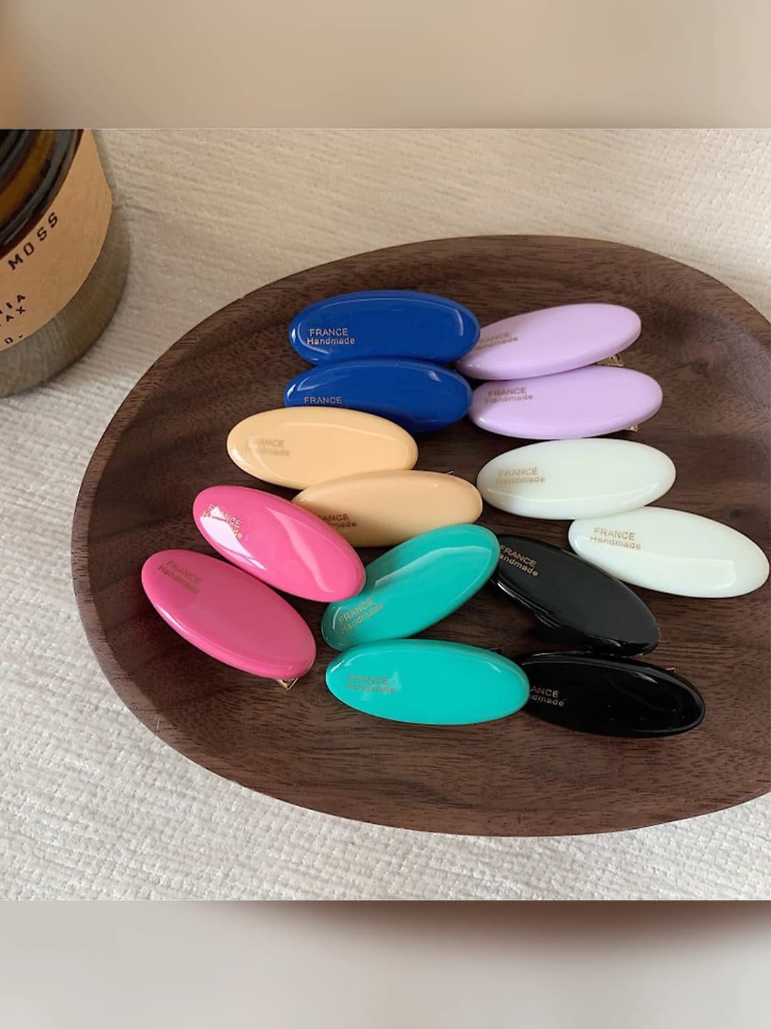 Women's small oval acetate hair clip with bow design element, country style