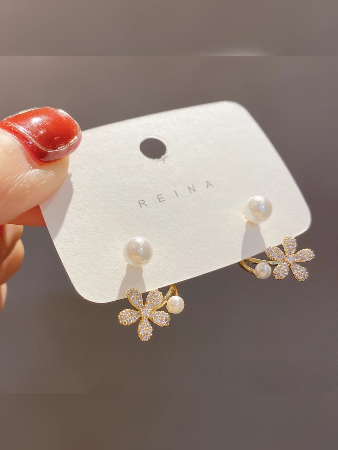 Women's Korean style pearl and flower earrings with rhinestone inlay, dual wear, light luxury stud earrings