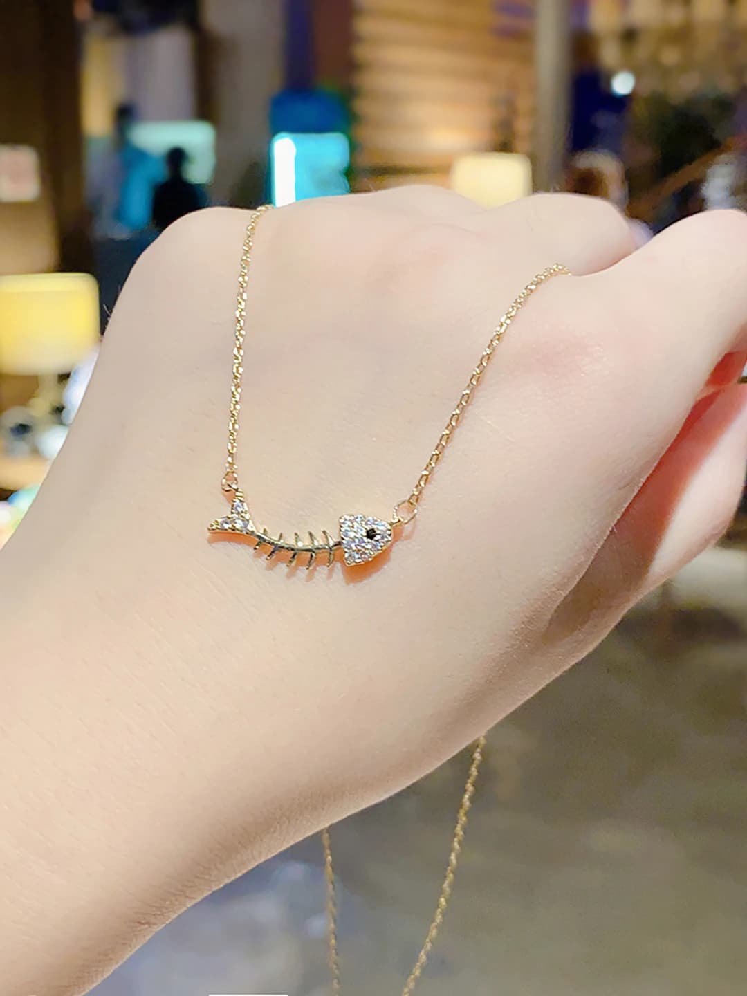 1192# Gold fishbone necklace