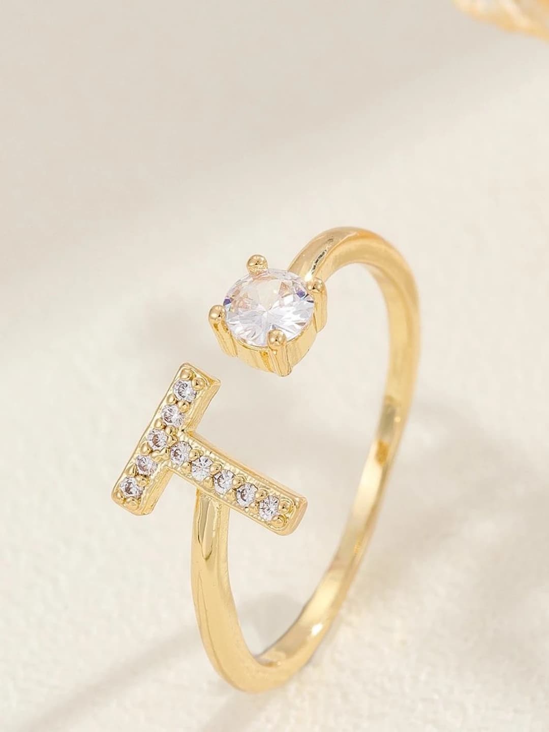 Gold letter T