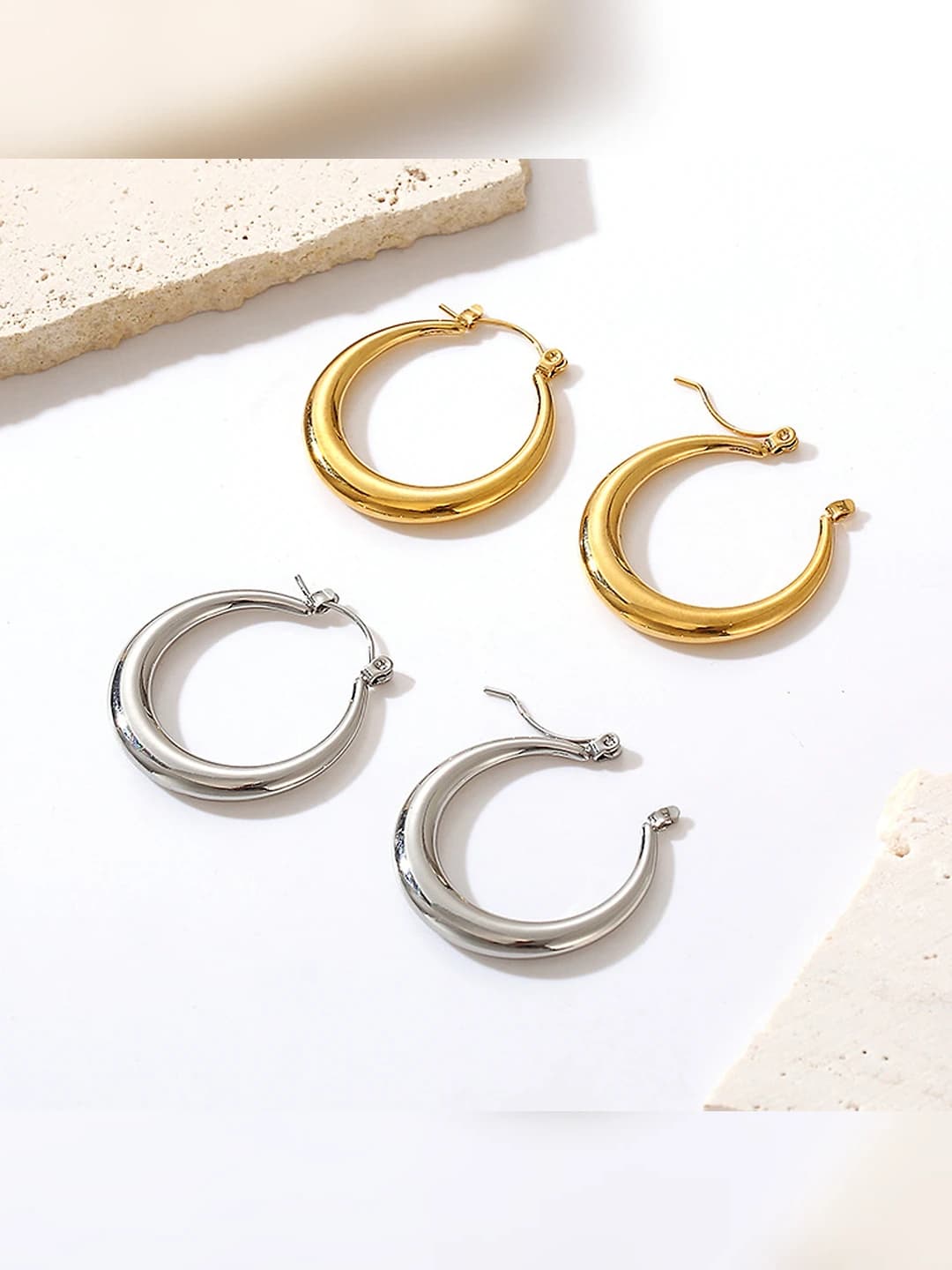 Women's round stainless steel hoop earrings with 18K geometric design