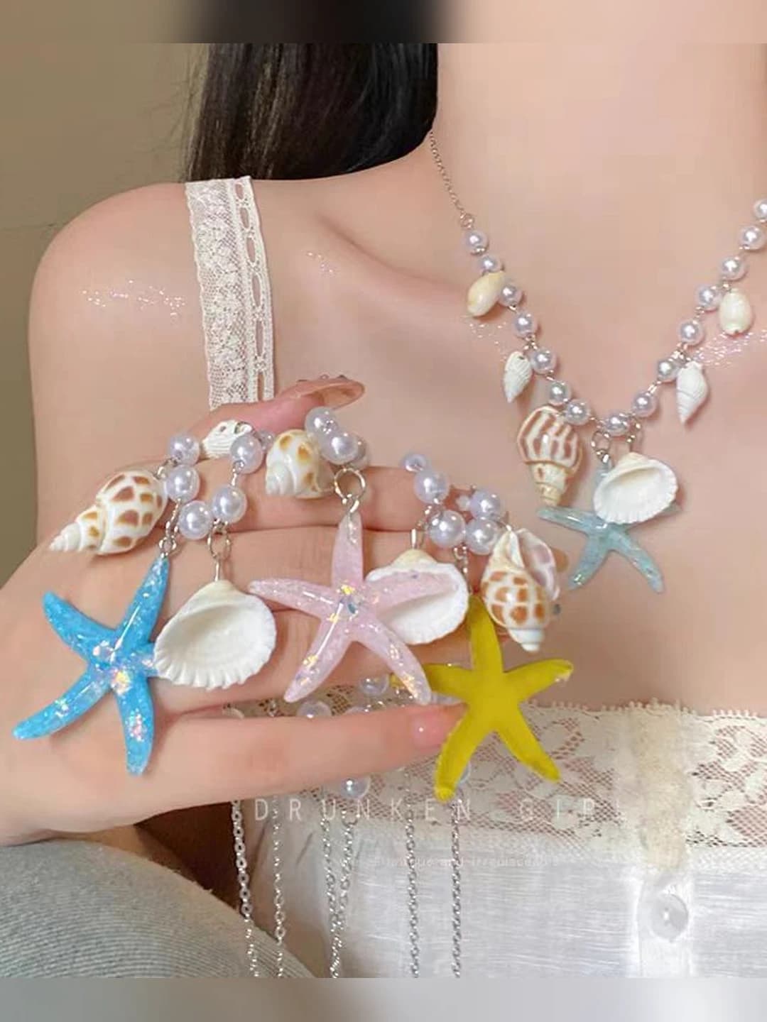 Women's star and shell chain necklace with designer details for beach photos