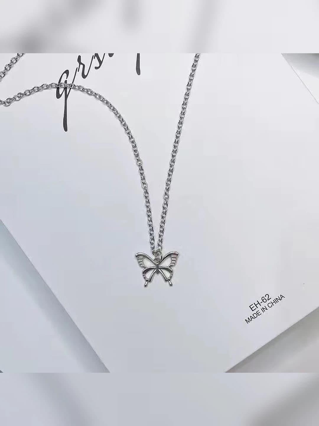 Silver, cutout butterfly