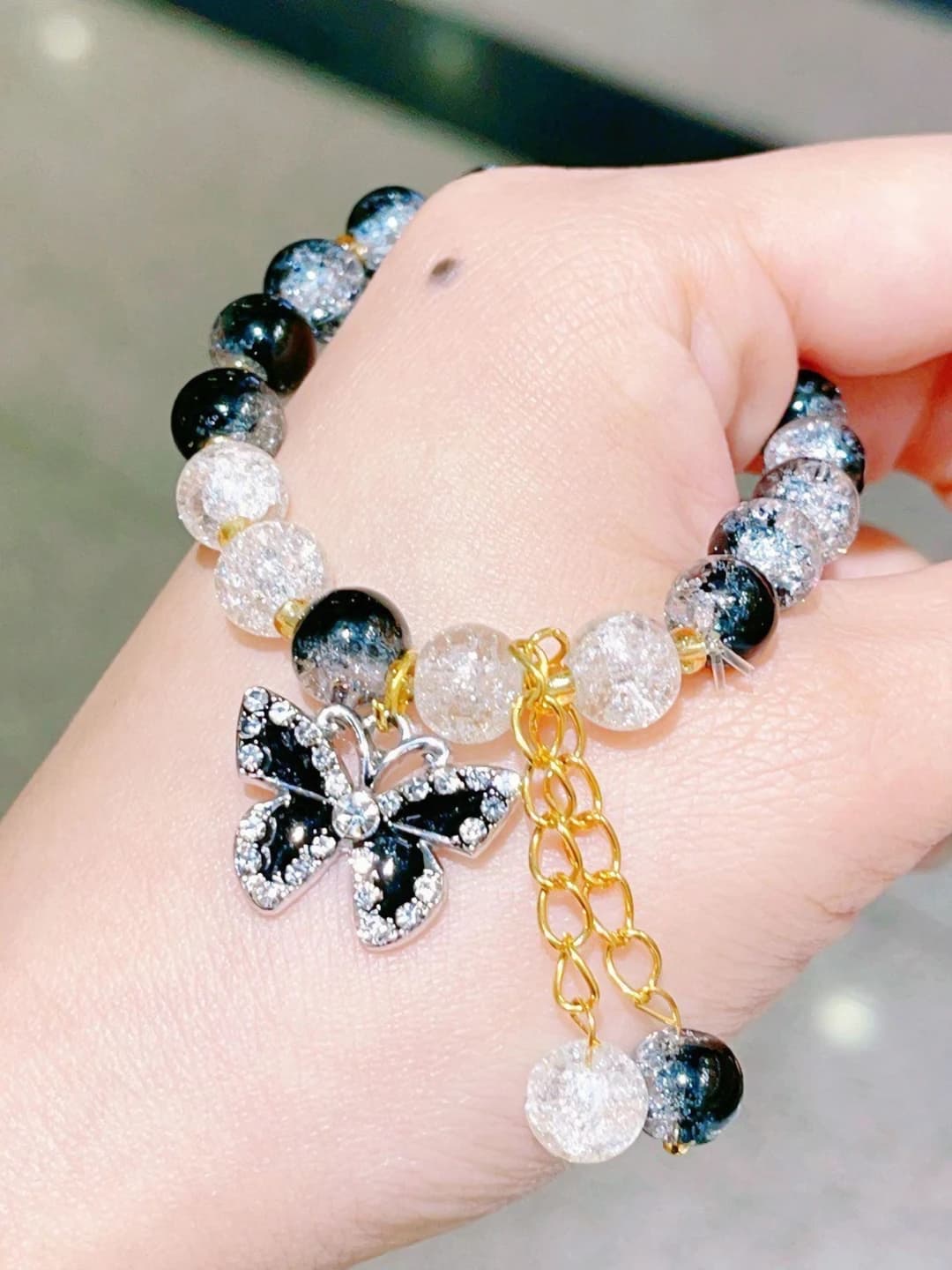Women's glass bracelet with crystals and butterfly, geometric design