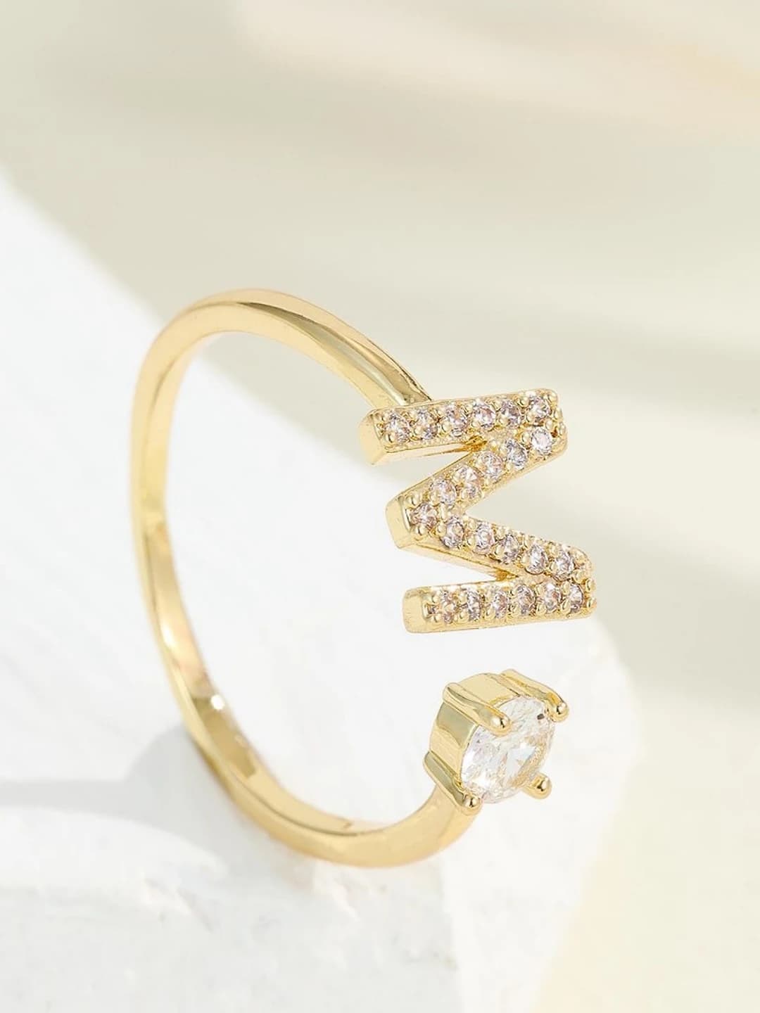 Gold letter M