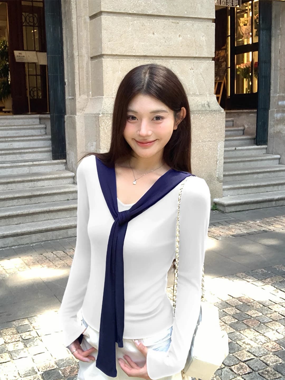 White, navy collar