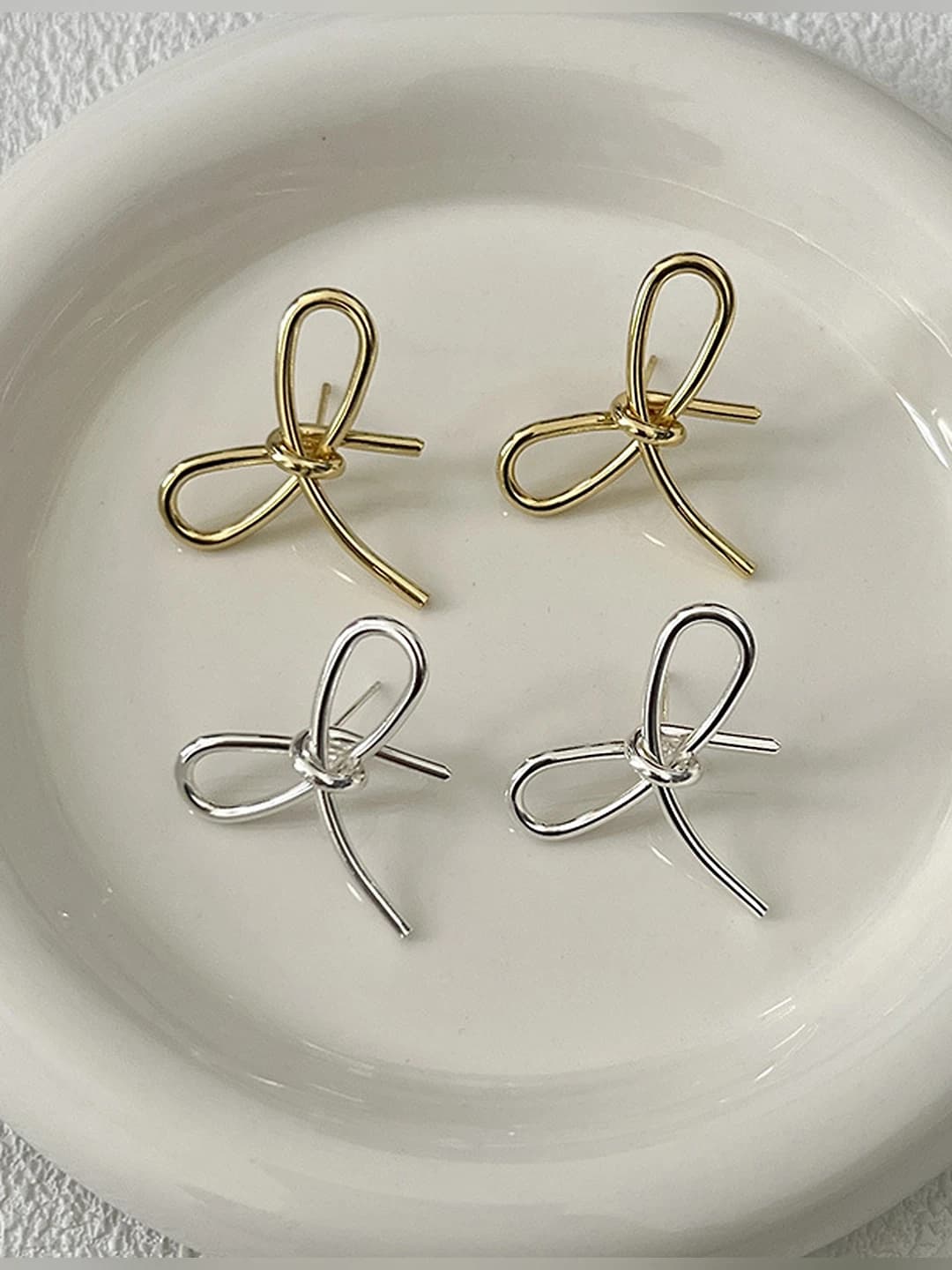 Women's silver ribbon bow stud earrings, simple and sweet design