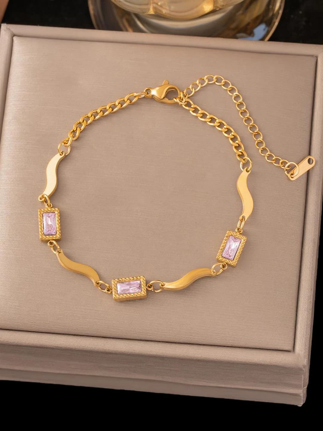 Three pink square diamonds, gold