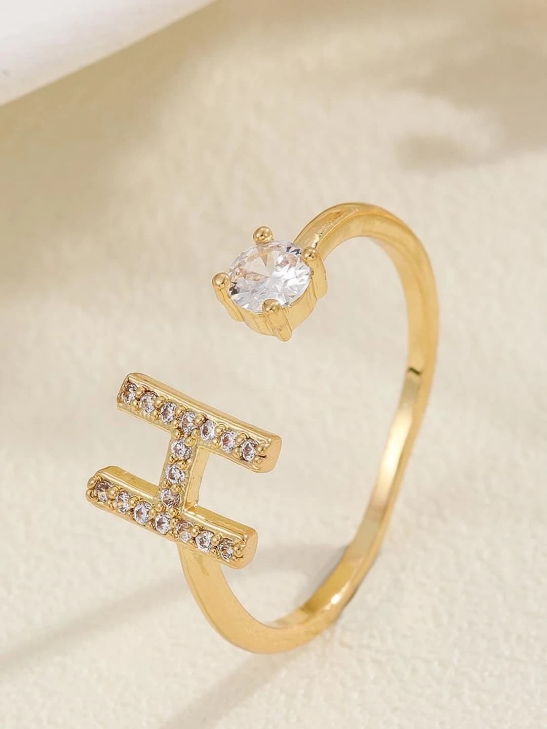 Gold letter H