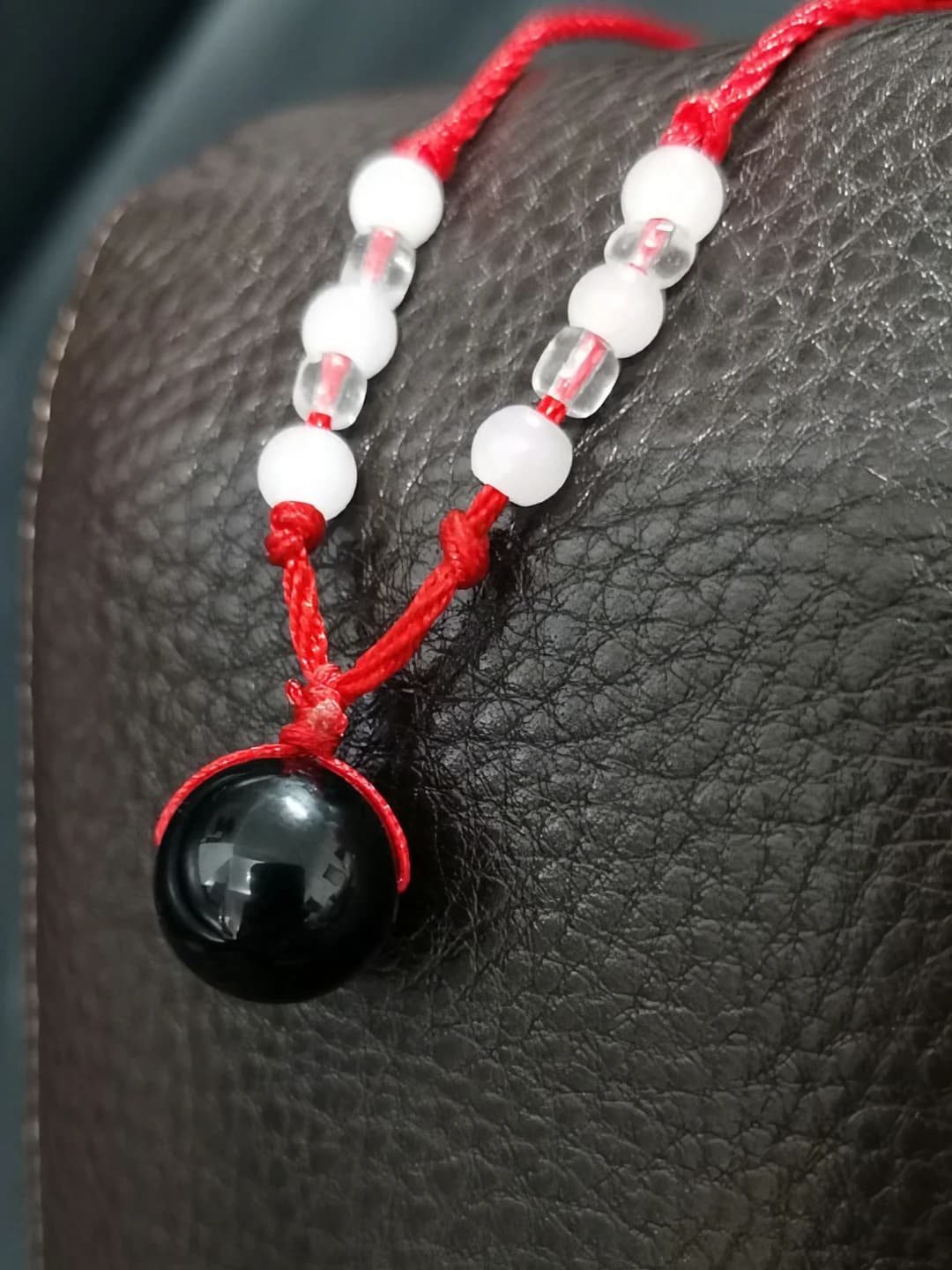 Red cord, black agate