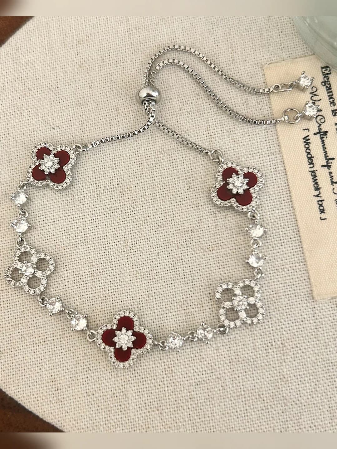 Silver bracelet with red flowers
