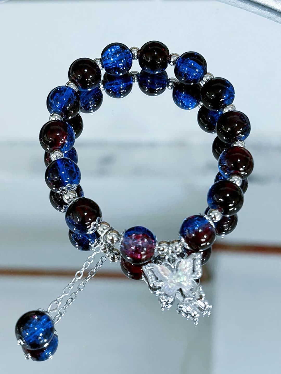 Red-blue beaded butterfly bracelet