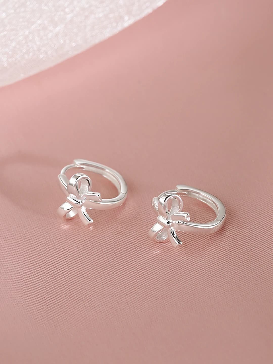 Silver bow stud earrings