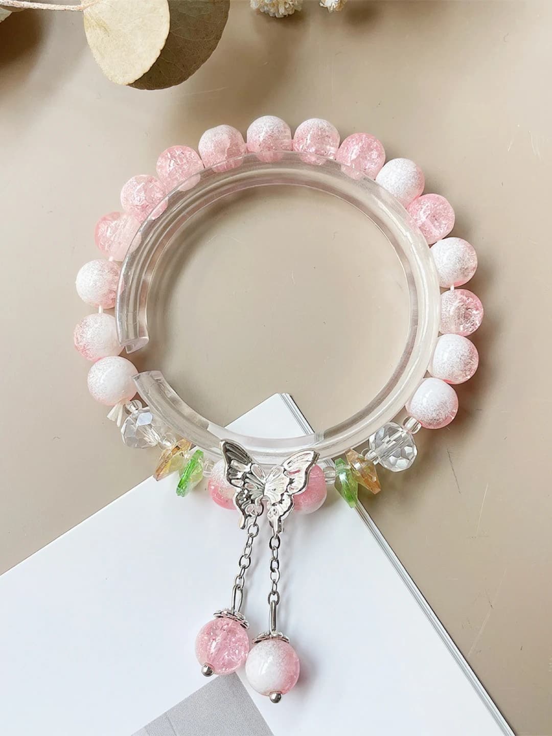 Pink, cream top, tassel, butterfly