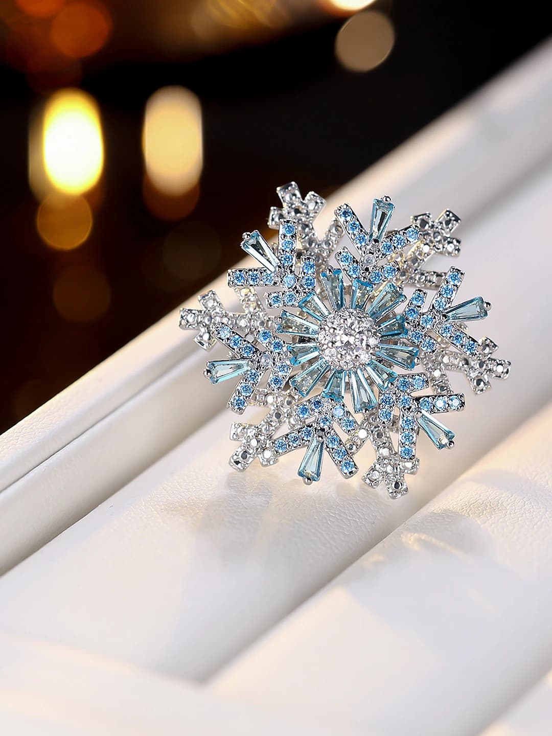 Women's gold-plated brass ring with cubic zirconia snowflake design