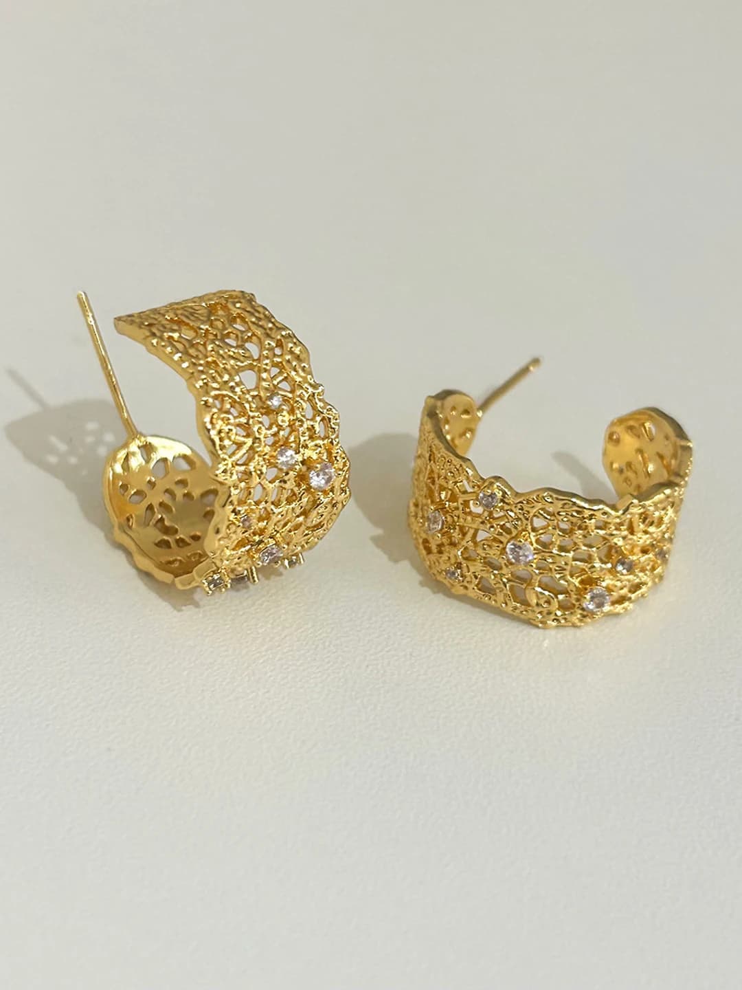 Gold stud earrings