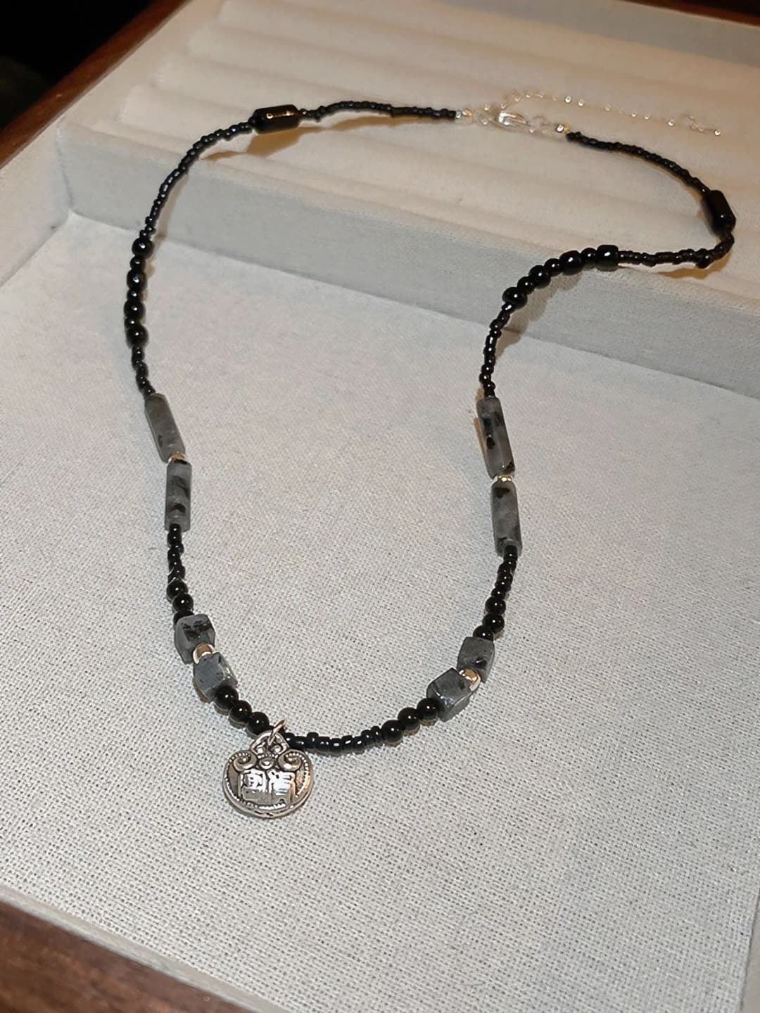 #54, black, lock charm