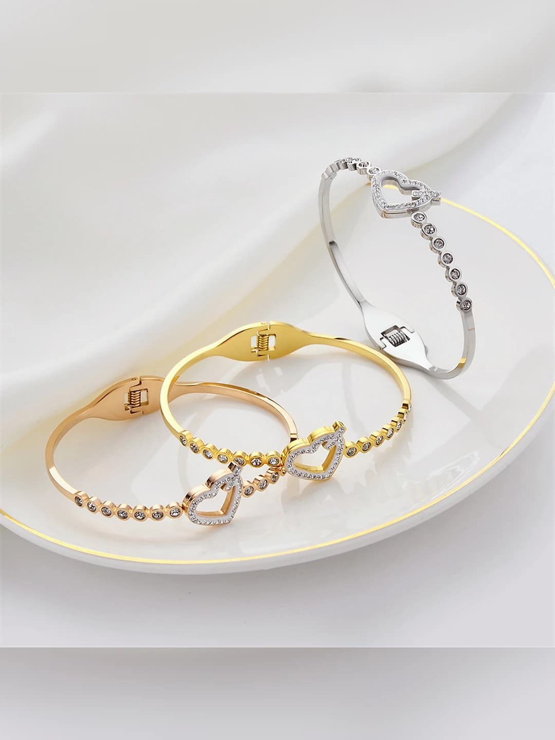 Women's titanium steel bracelet with rose gold plating and rhinestone heart design
