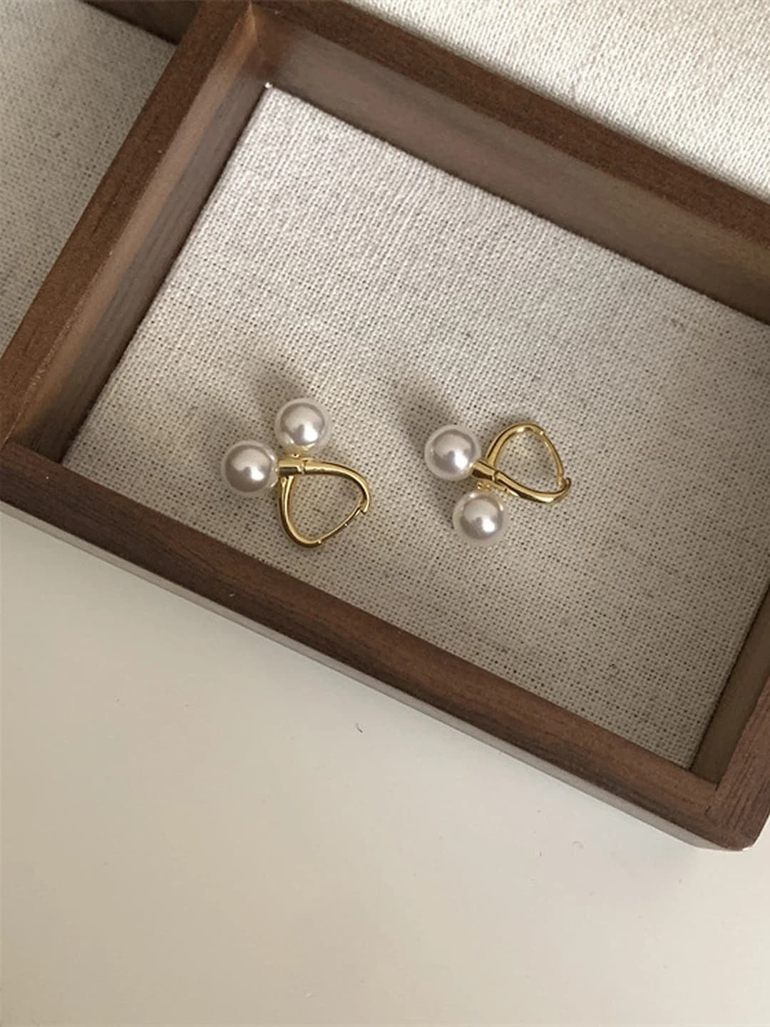 Gold bright pearl cross earrings