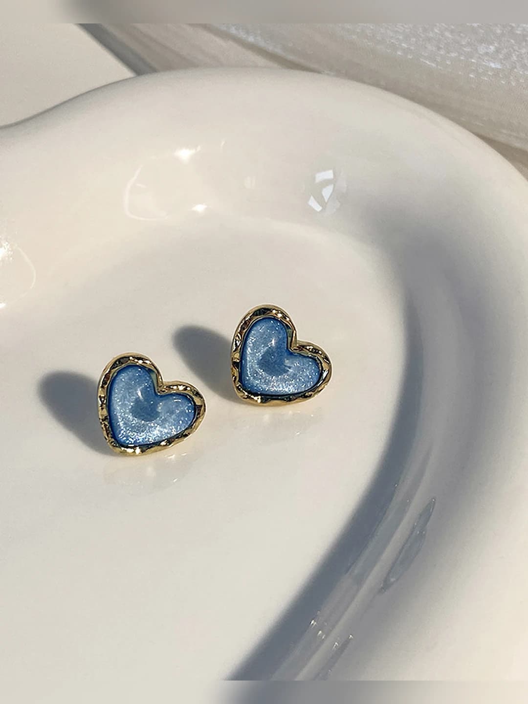 Sparkling blue heart stud pair