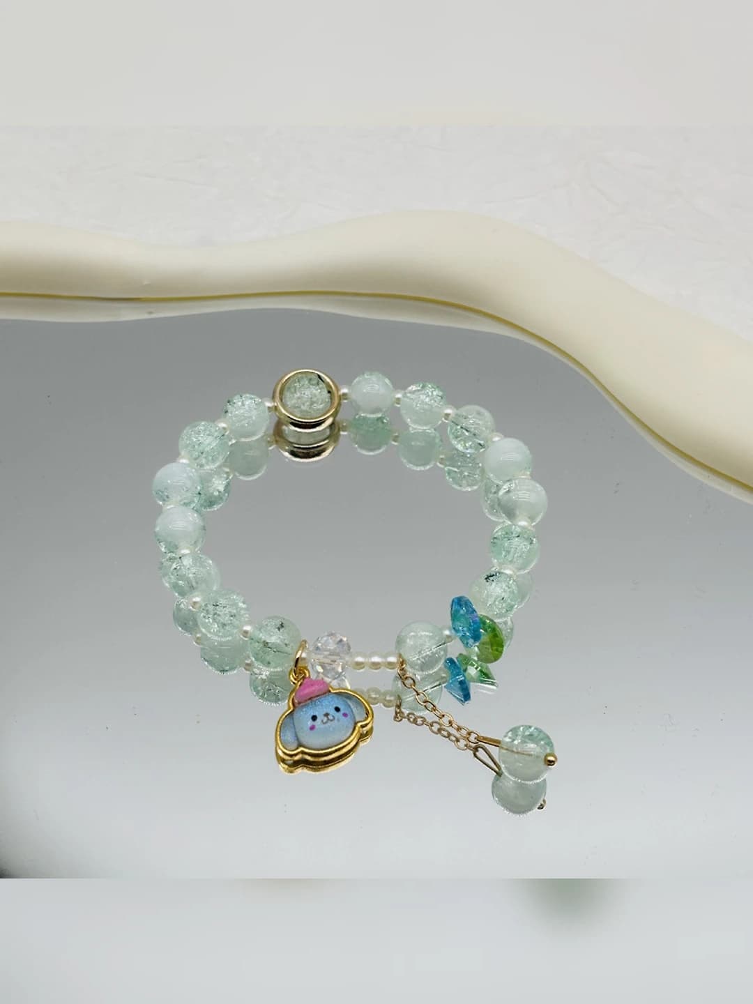 Blue Cinnamoroll hat green bracelet