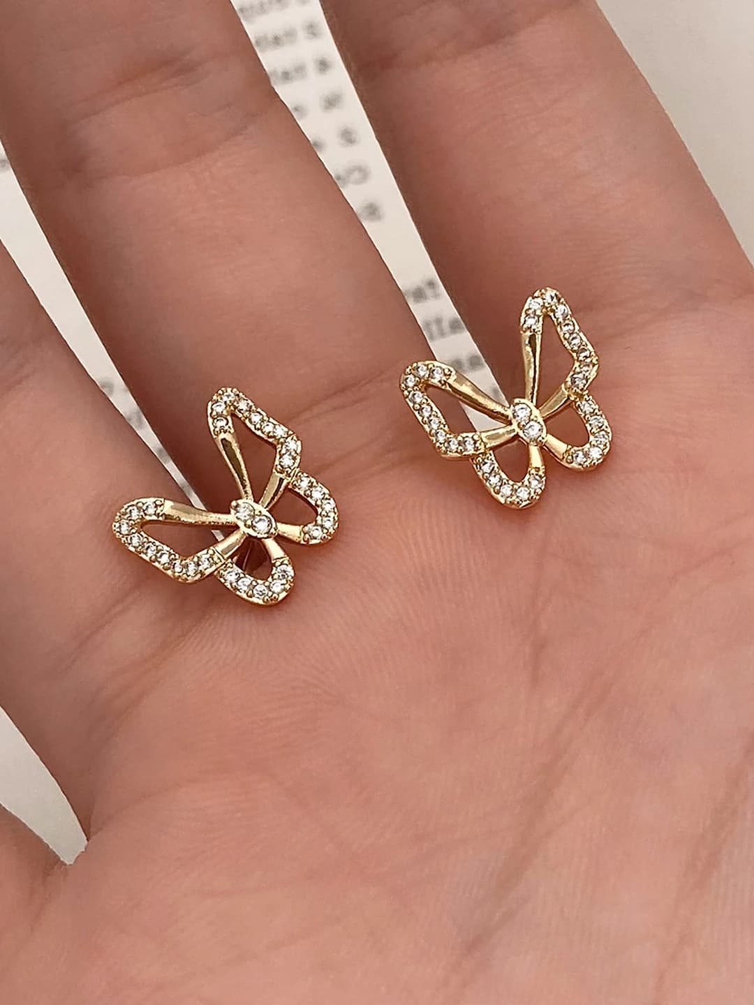 Gold bow zircon ear studs
