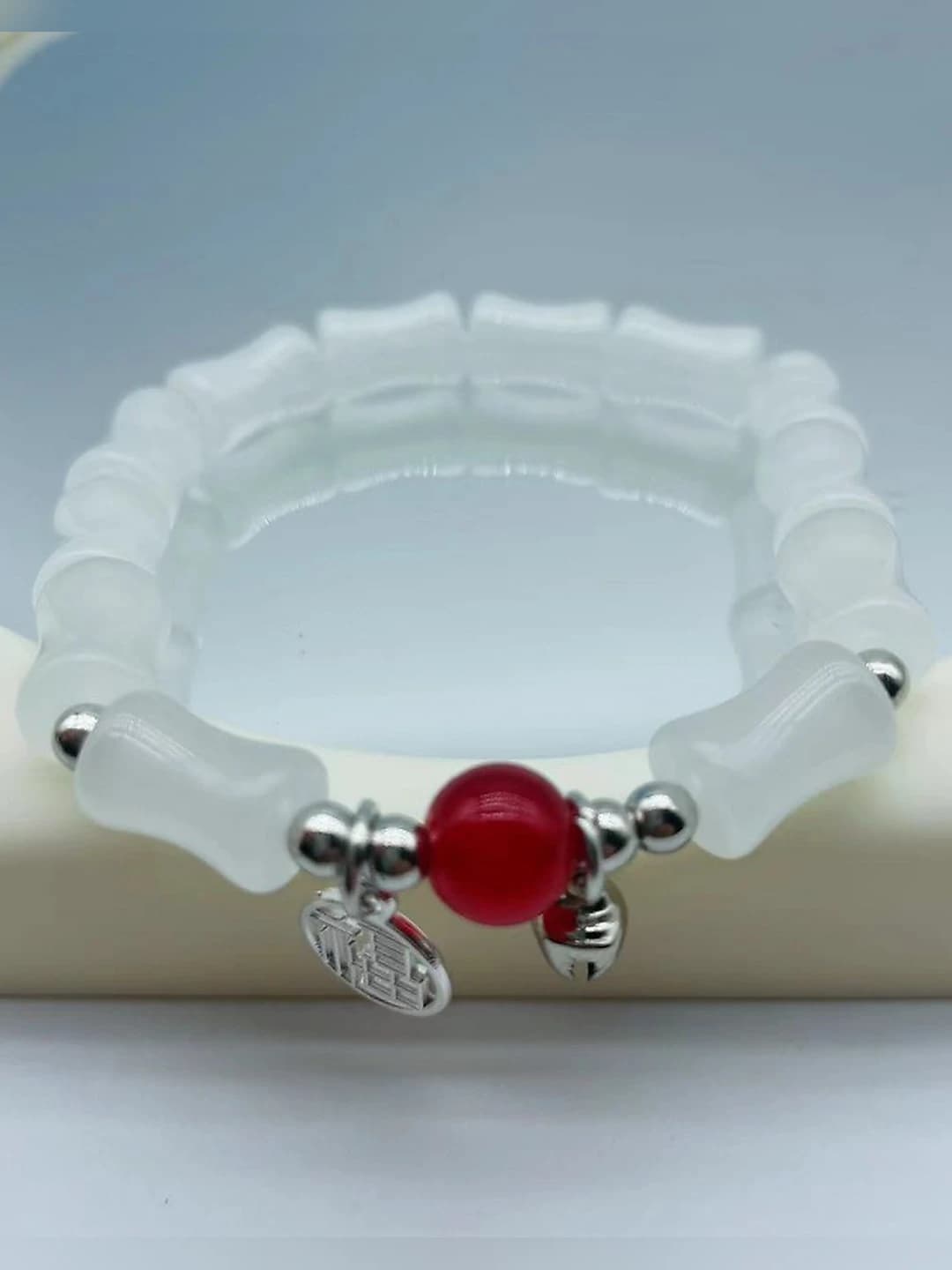 White bamboo fu red bead bracelet