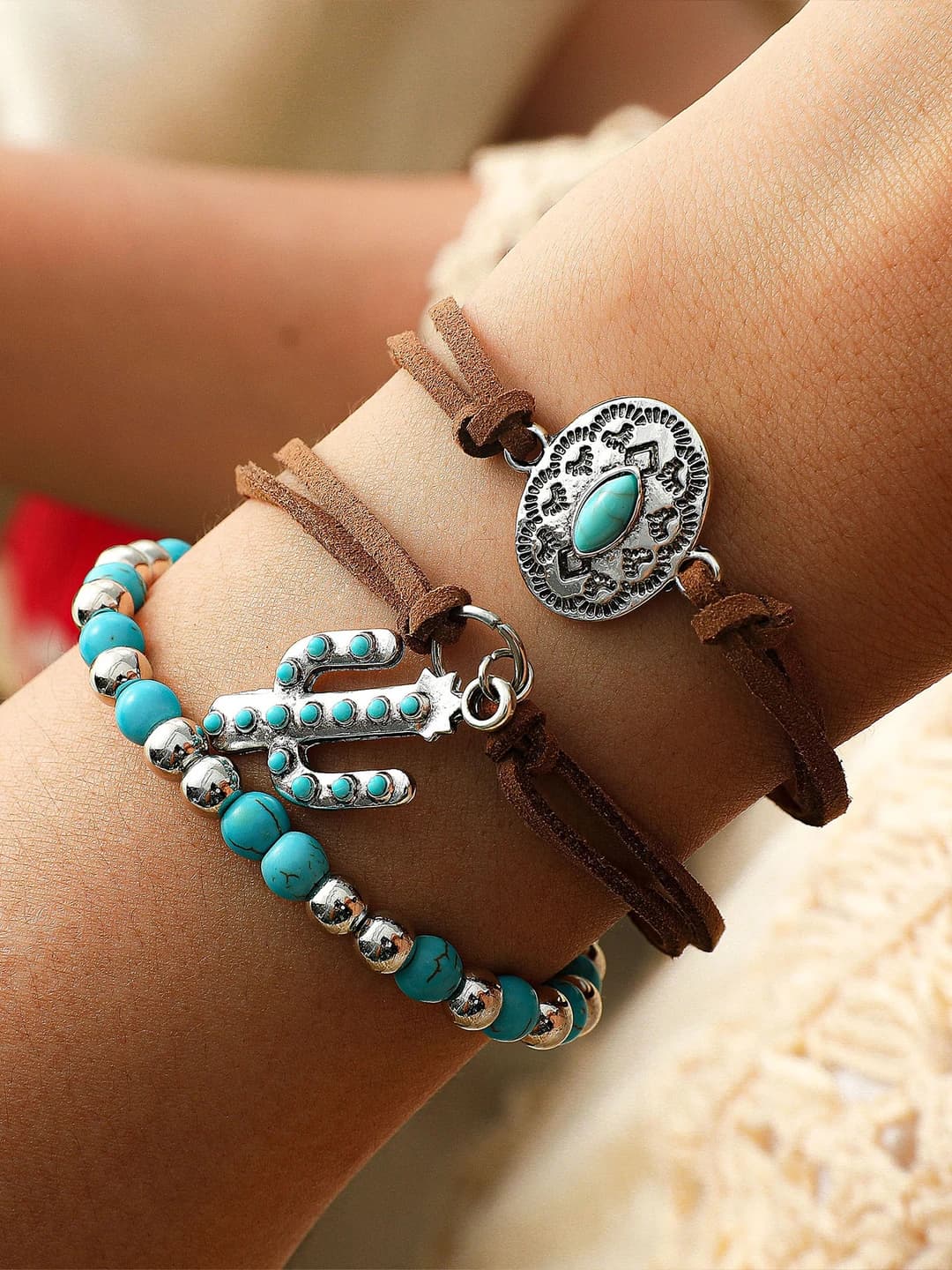 Women's retro style bracelet set with geometric shape, design elements: tassels, chains, and asymmetry