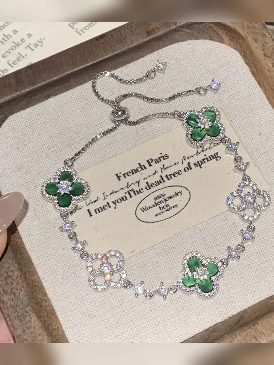 Silver bracelet with green flowers