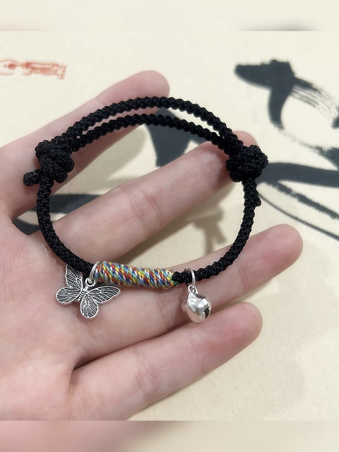 M756 Butterfly Bell Bracelet Black Cord