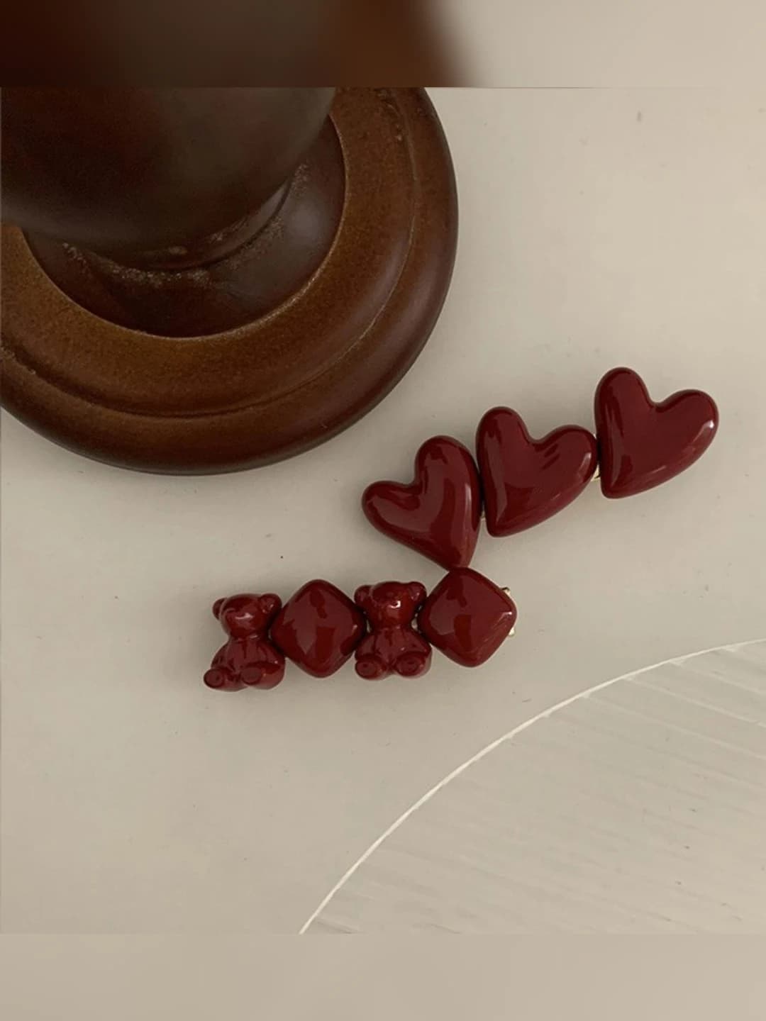 Women's red plastic handcrafted hair clip with music notes