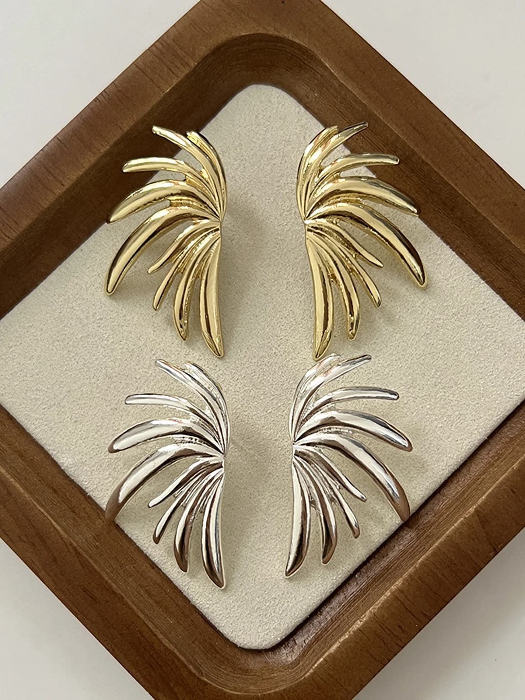 Women's wing-shaped metal stud earrings in retro style