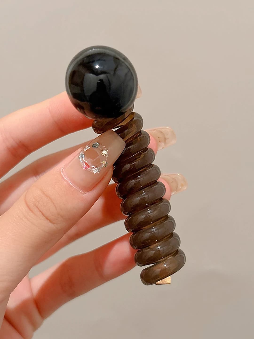 Brown, telephone cord, black pearls
