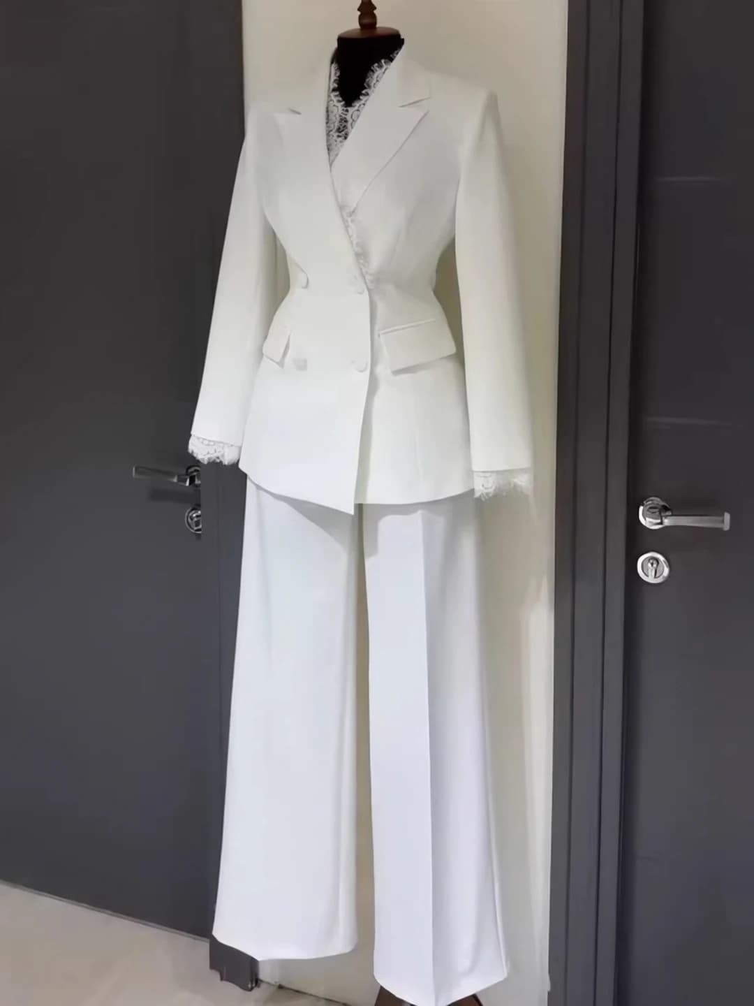 Women's suit with trousers with lace edge and buttons straight cut
