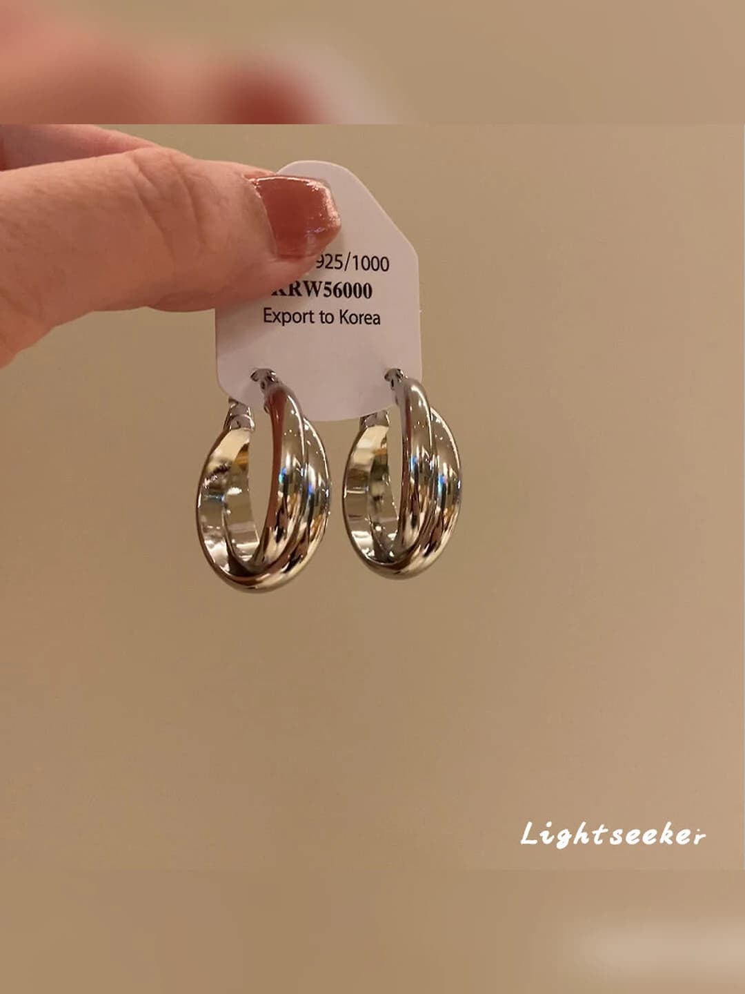 Glossy silver twisted hoop earrings ~2.1 cm