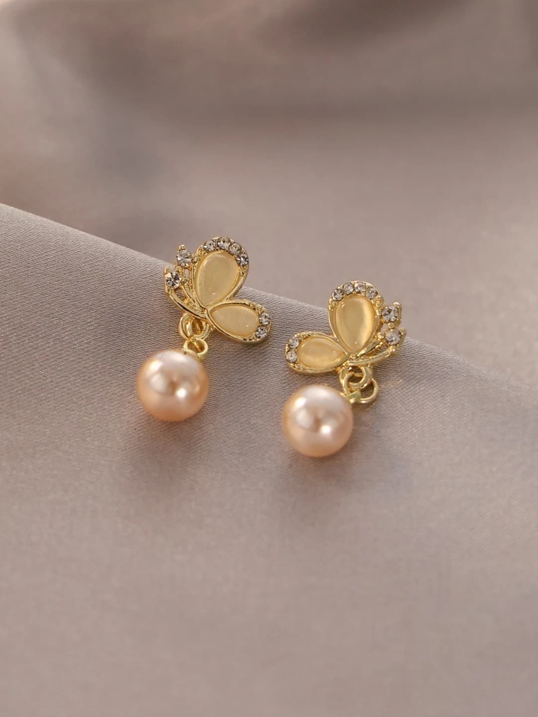 Champagne faux pearl butterfly studs