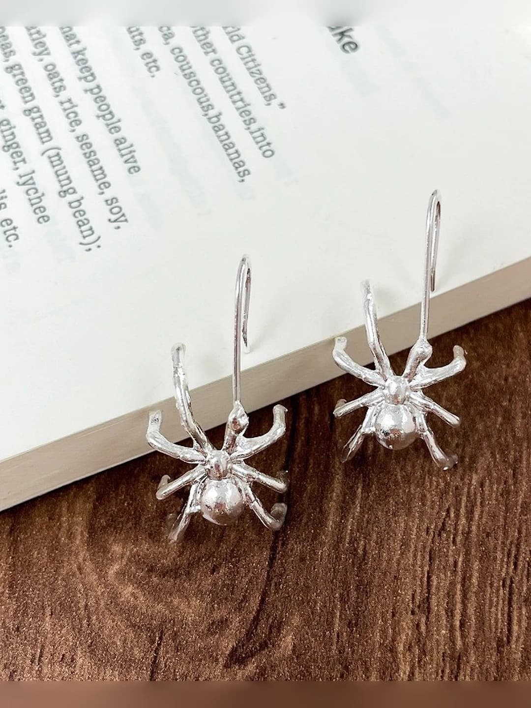 Silver spider earring
