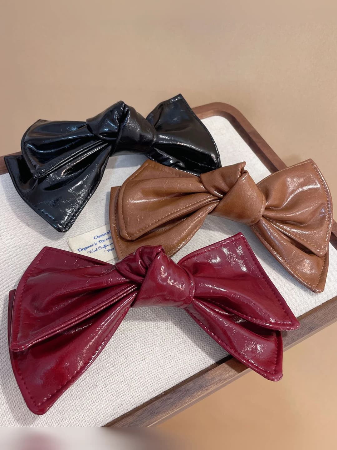 Women's retro PU hair clips and combs with spring mechanism, positioned at the back of the head, 2026 new model, light luxury, bow design element