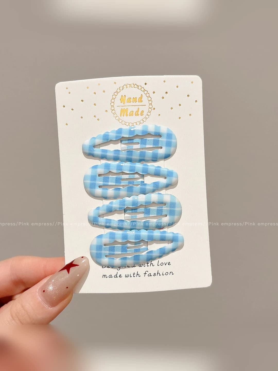 2# Light blue polka dot 4 clips, ~4.5 cm