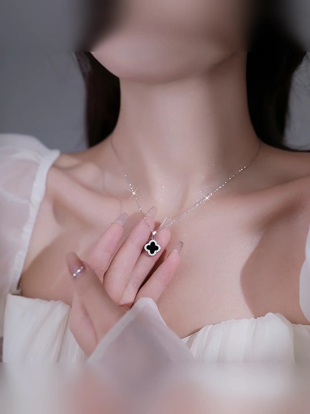 Silver chain, black clover