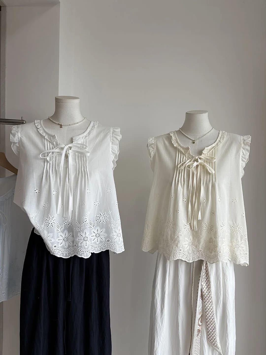 Women's 2026 summer Korean style blouse with crew neck, short sleeve, loose fit, floral pattern, tie and cutout details
